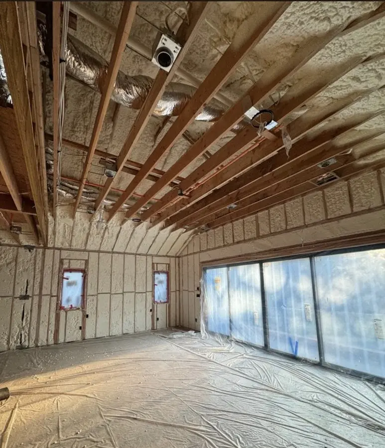 Interior walls and ceiling insulated with spray foam during new construction in East Lake